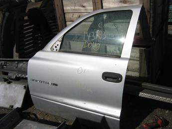 2001 2002 2003 Dodge Dakota drivers side power crew cab front door with glass & hardware.  Rear corner is bent in, some scratches in door.  Reference inventory #10888 when inquiring.