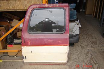 73 - 91 Chevrolet Suburban Left Side OEM Rear Cargo Door.  Dent in middle of door.  Red & tan in color.