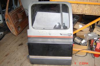 73 - 91 Chevrolet Suburban Left Side OEM Secondary Door.  Excellent condition.  Black & grey in color.