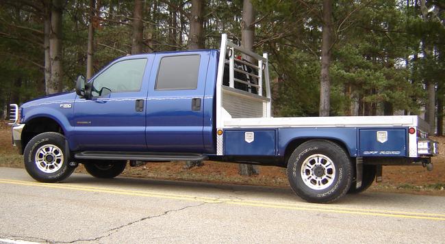Southern Truck has restored this 2000 Ford F350 Superduty pick up truck.  Custom flatbed, 12000 lb. winch installed, brush guard and tool boxes are just some of the goodies that were added to this truck to make it a ONE OF A KIND!!